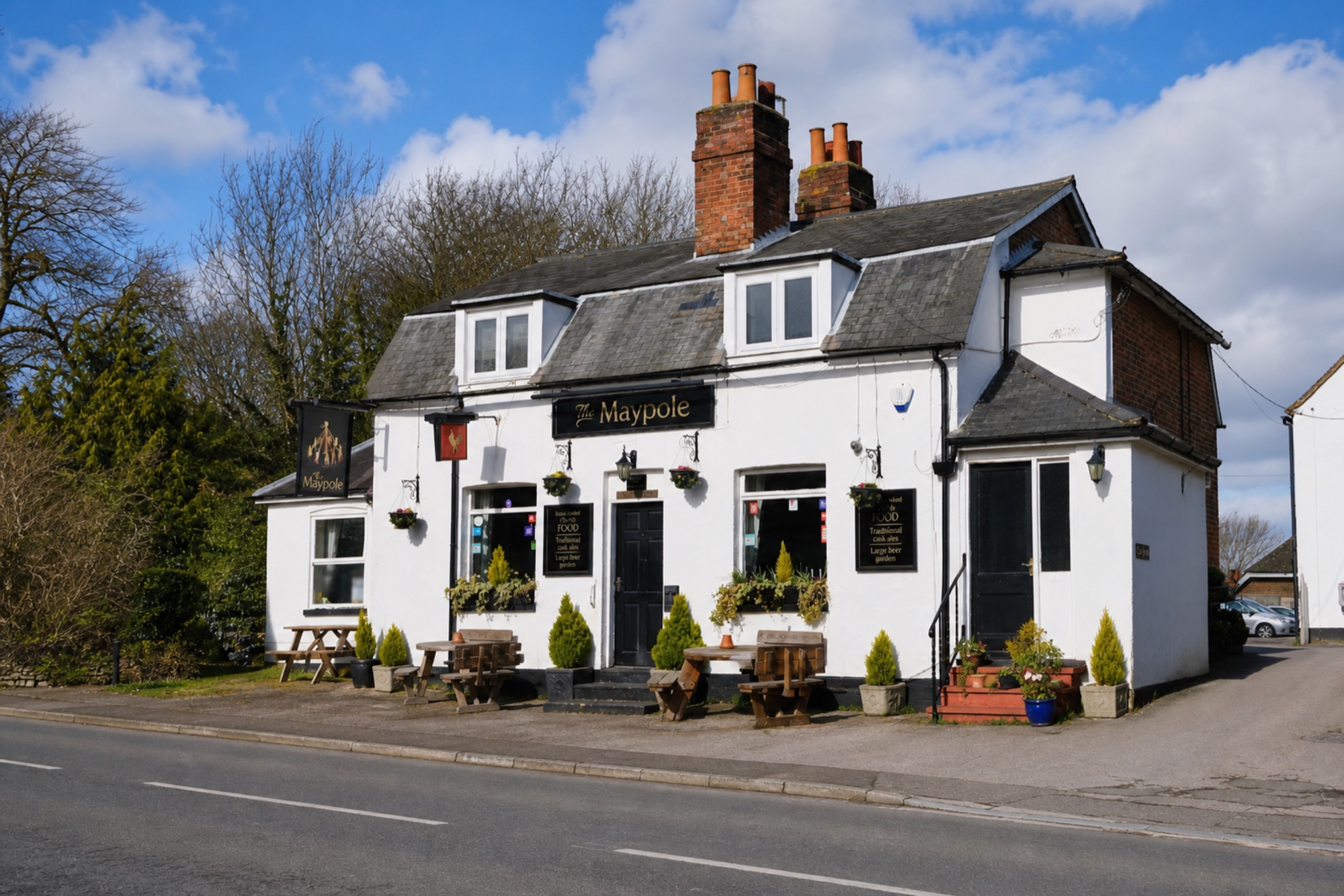 The Maypole Inn exterior on a sunny day