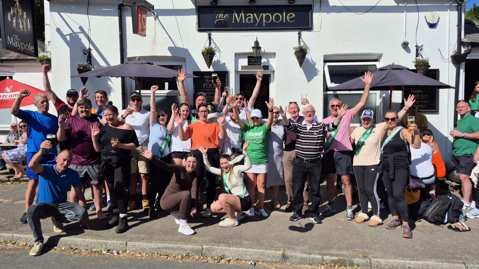 A big group celebrating outside The Maypole Inn