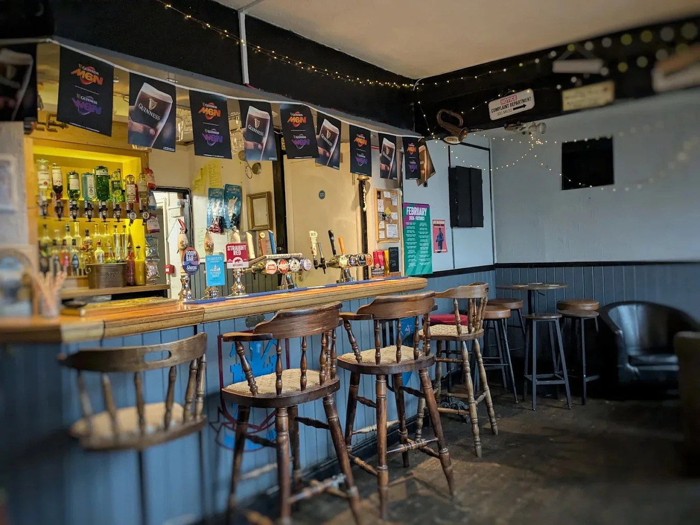 The cosy bar and seating area inside The Maypole Inn