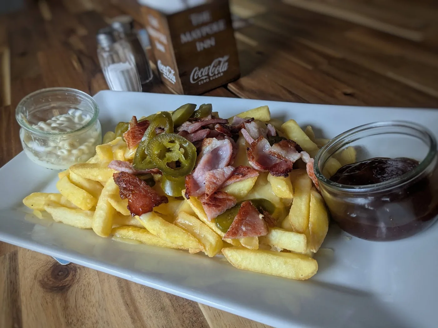 Loaded dirty fries with bacon and jalapeños